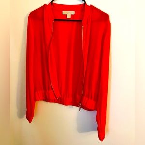 Michael Kors orange thin zip-up jacket.